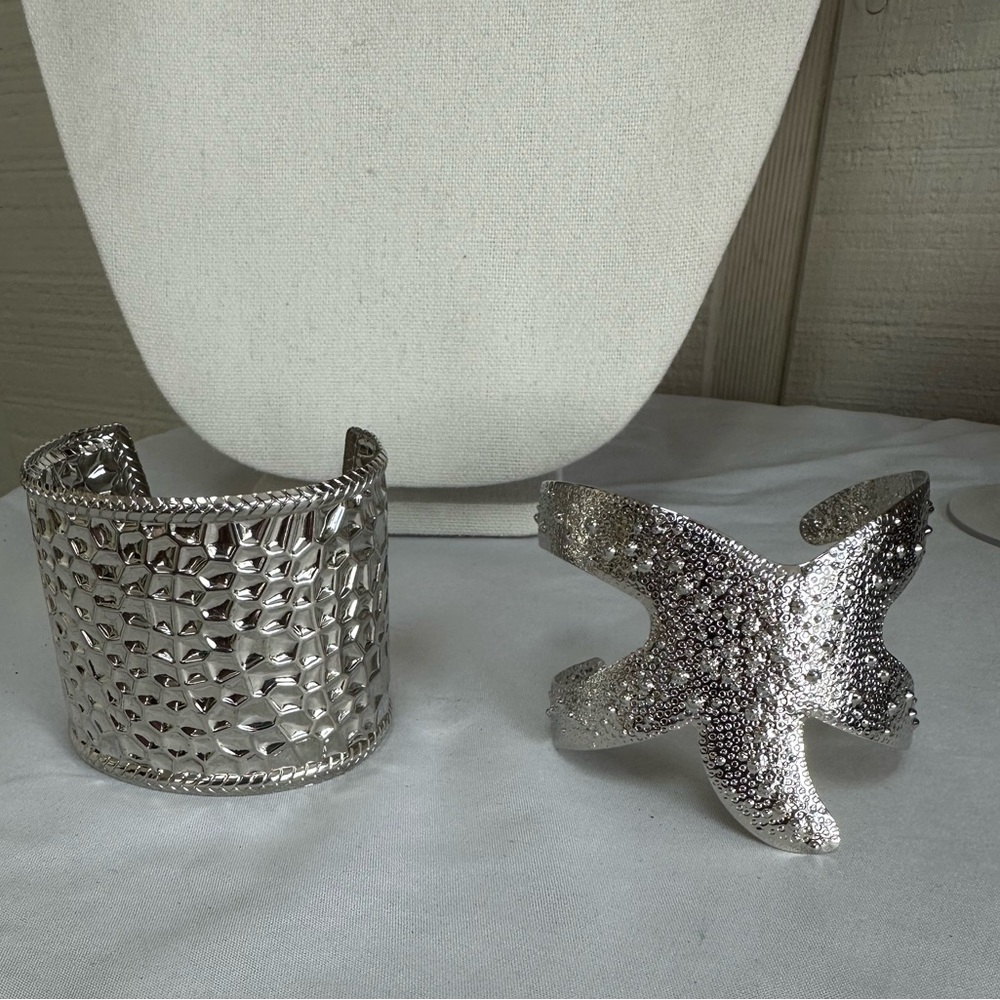 Two bright silvertone cuff bracelets